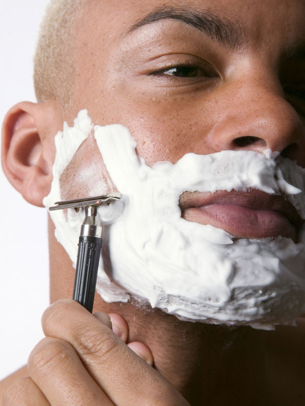 Man of color shaving