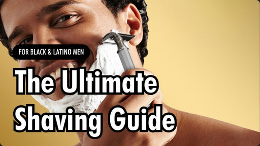 Brown skin man with curly hair shaving with ThatsSmoooth Classic Safety Razor